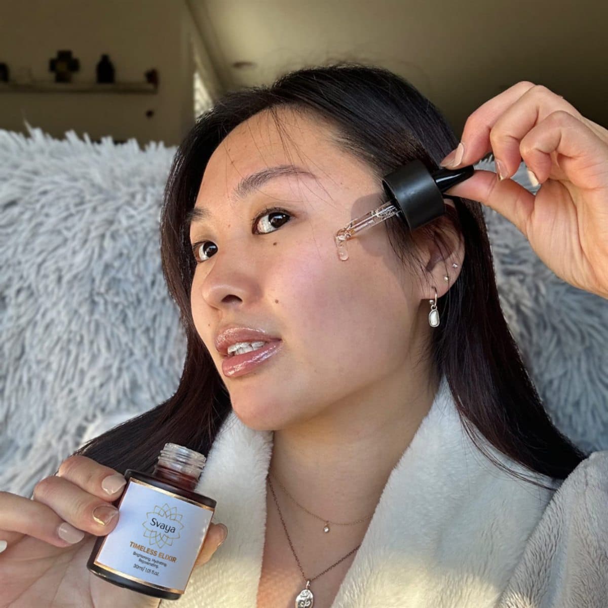 A customer applying Timeless Elixir at the end of the day